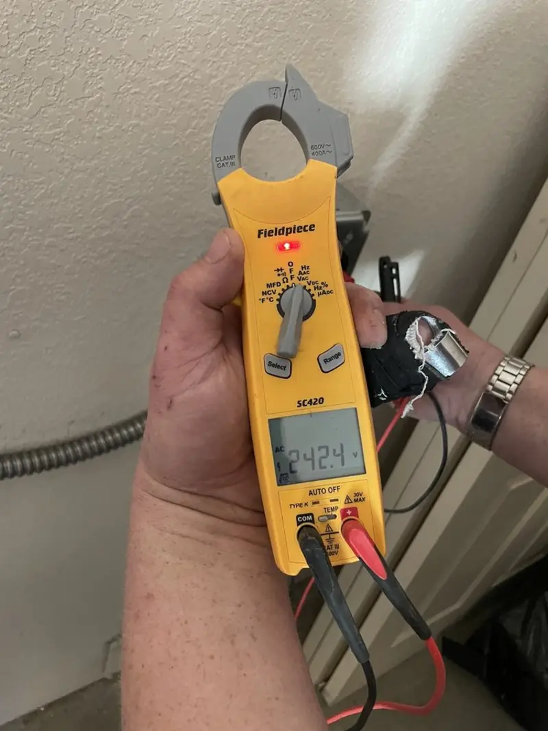 Voltage testing with clamp meter during Ceiling Fan Installation in Wadena